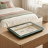 Jewellery tray styled with jewellery on a bedside table